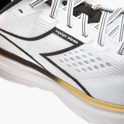Diadora Men's Equipe Atomo Running Shoe - White/Gold/Black - Regular (D) -Patagonia Shop 101.178051 C2149 30 HR