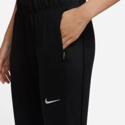 Women's Nike Therma-FIT Essential Running Pants - Black/Black/Reflective Silver 11 Women's Nike Therma-FIT Essential Running Pants - Black/Black/Reflective Silver -Patagonia Shop DD6472 010 PHSYM002 2000